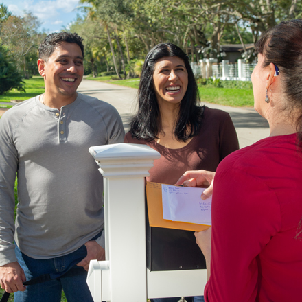 Neighbors talking by a mailbox