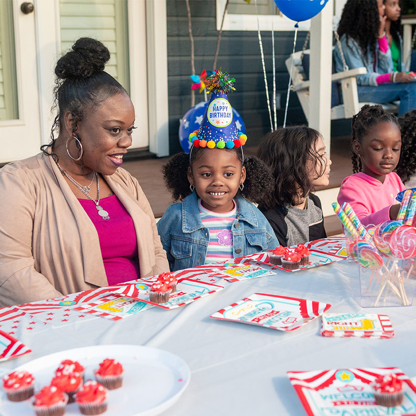 A mother celebrates a birthday with her daughter knowing they're protected by TruStage Whole Life Insurance